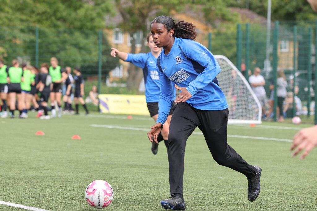 black skin female plays football