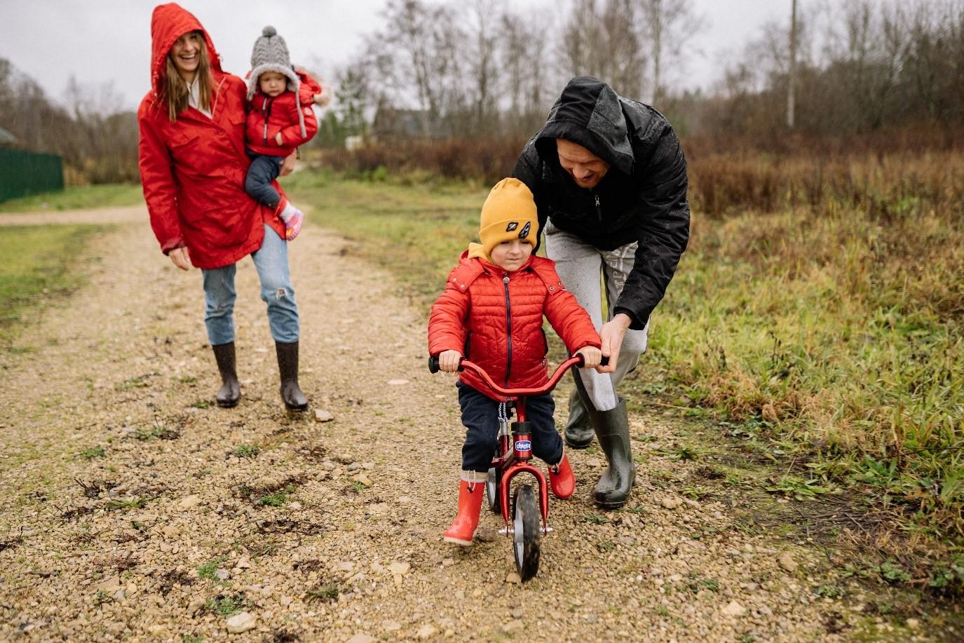 family walk outdoors on path