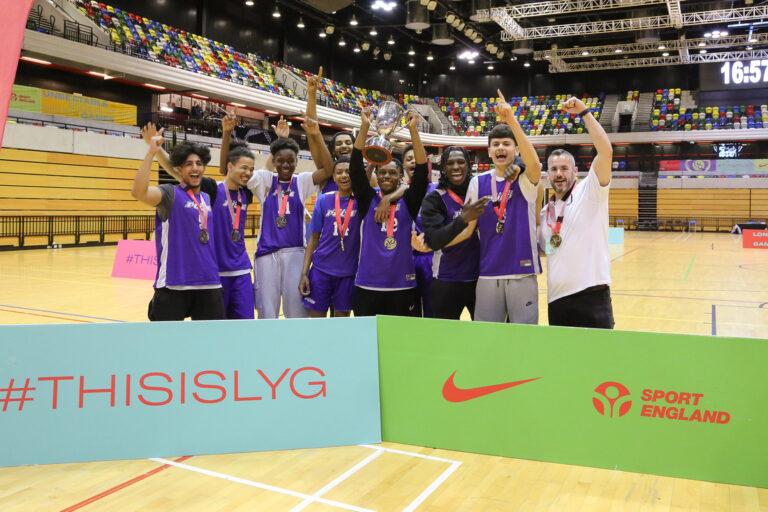 Ealing team lift trophy at basketball at Copper Box Arena