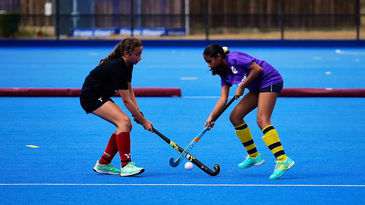 ethnically diverse girls play hockey