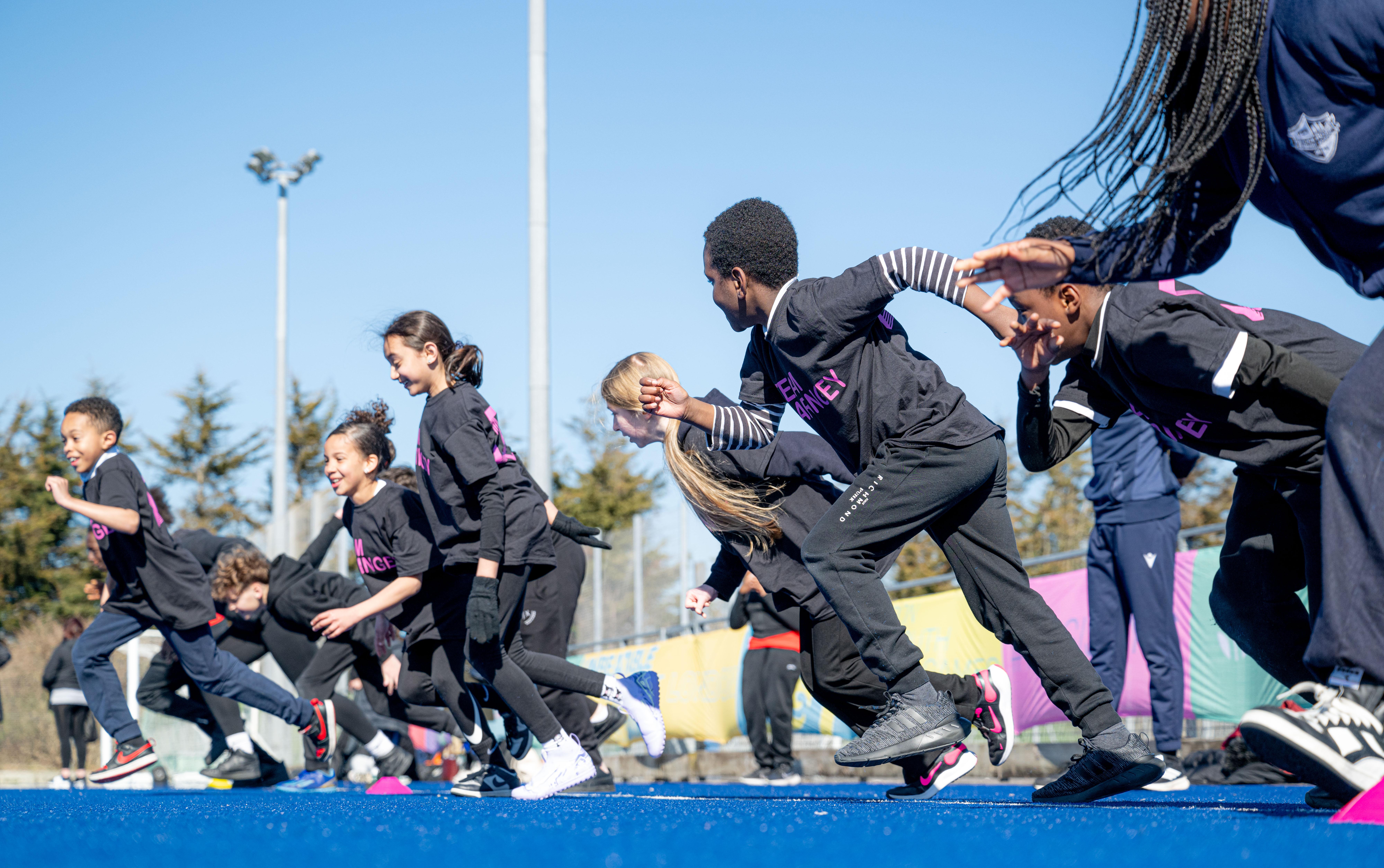 ethnic diverse kids smile and run