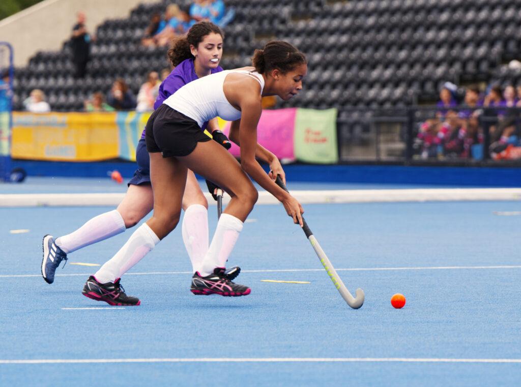 mixed ethnicity girls play hockey