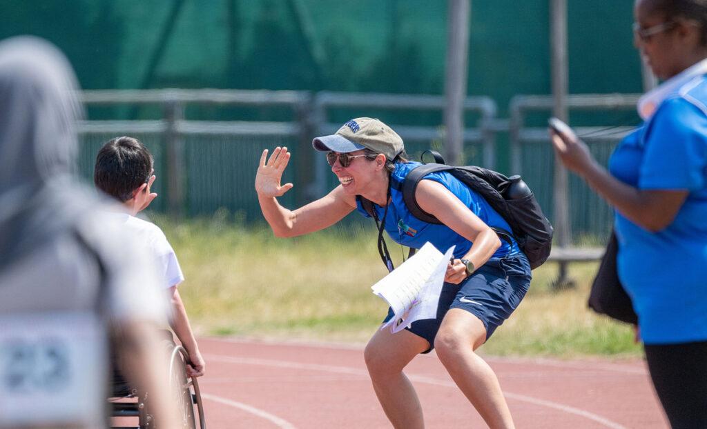 white female high fives
