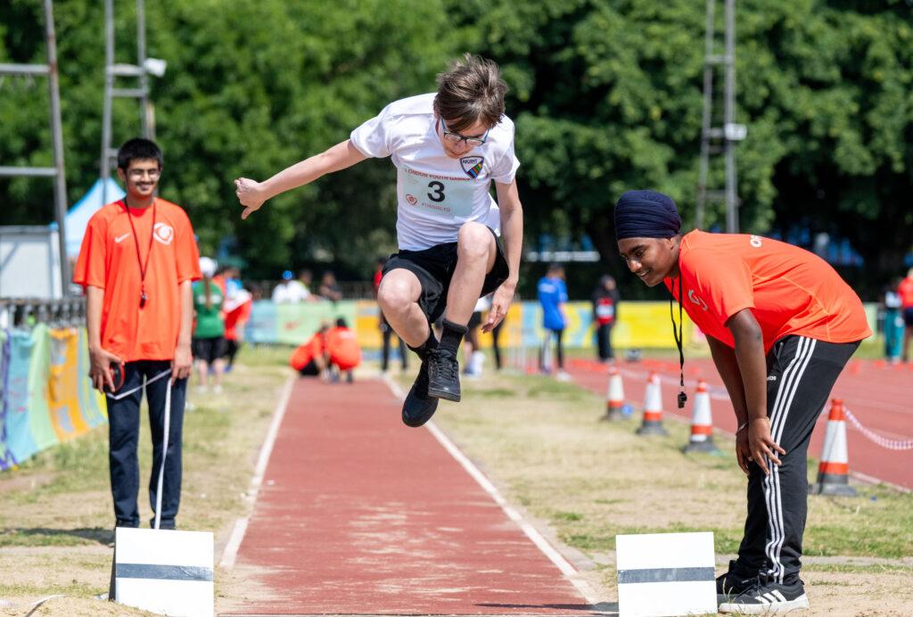 ethnically diverse people in long jump
