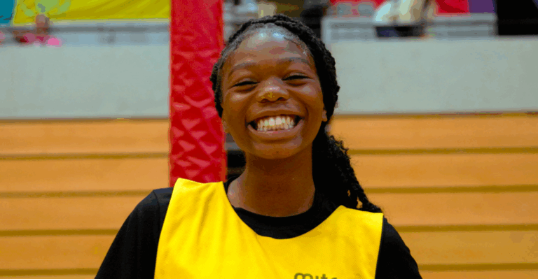 diving, black female smiles in yellow bib