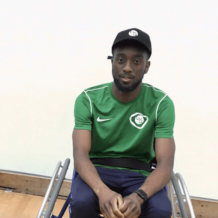 black male in green t shirt