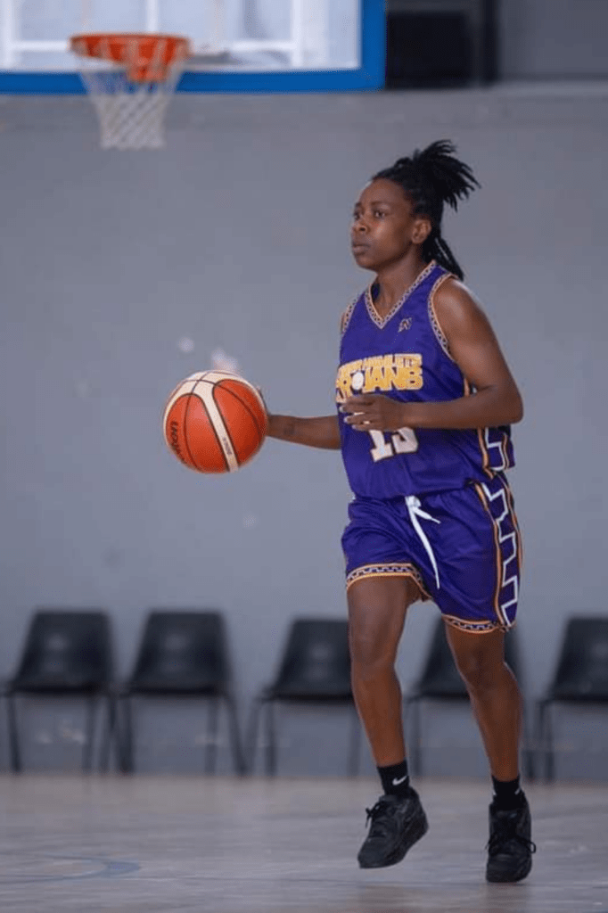 black female plays basketball
